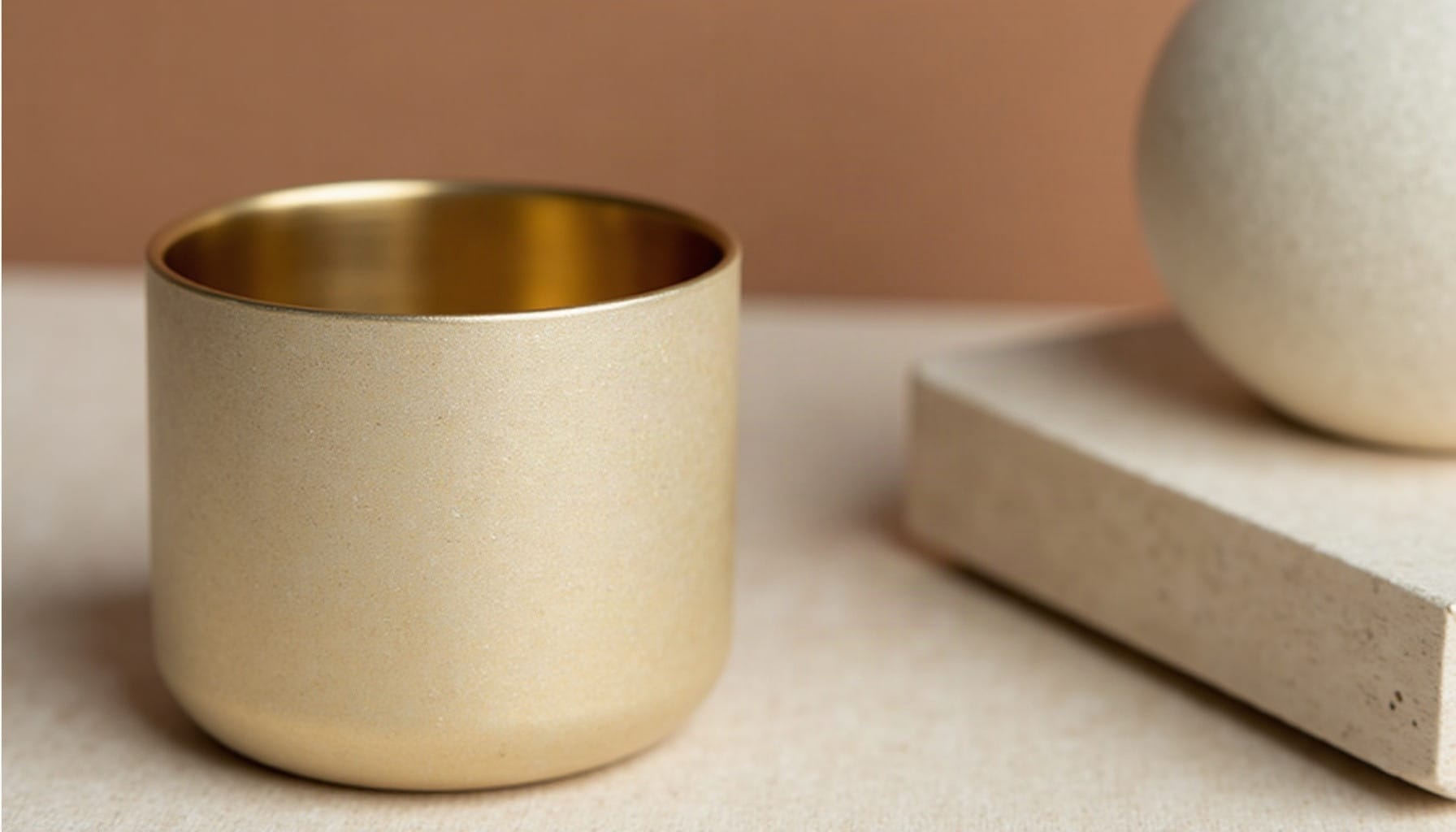 gold living room accessories, warm minimal detail